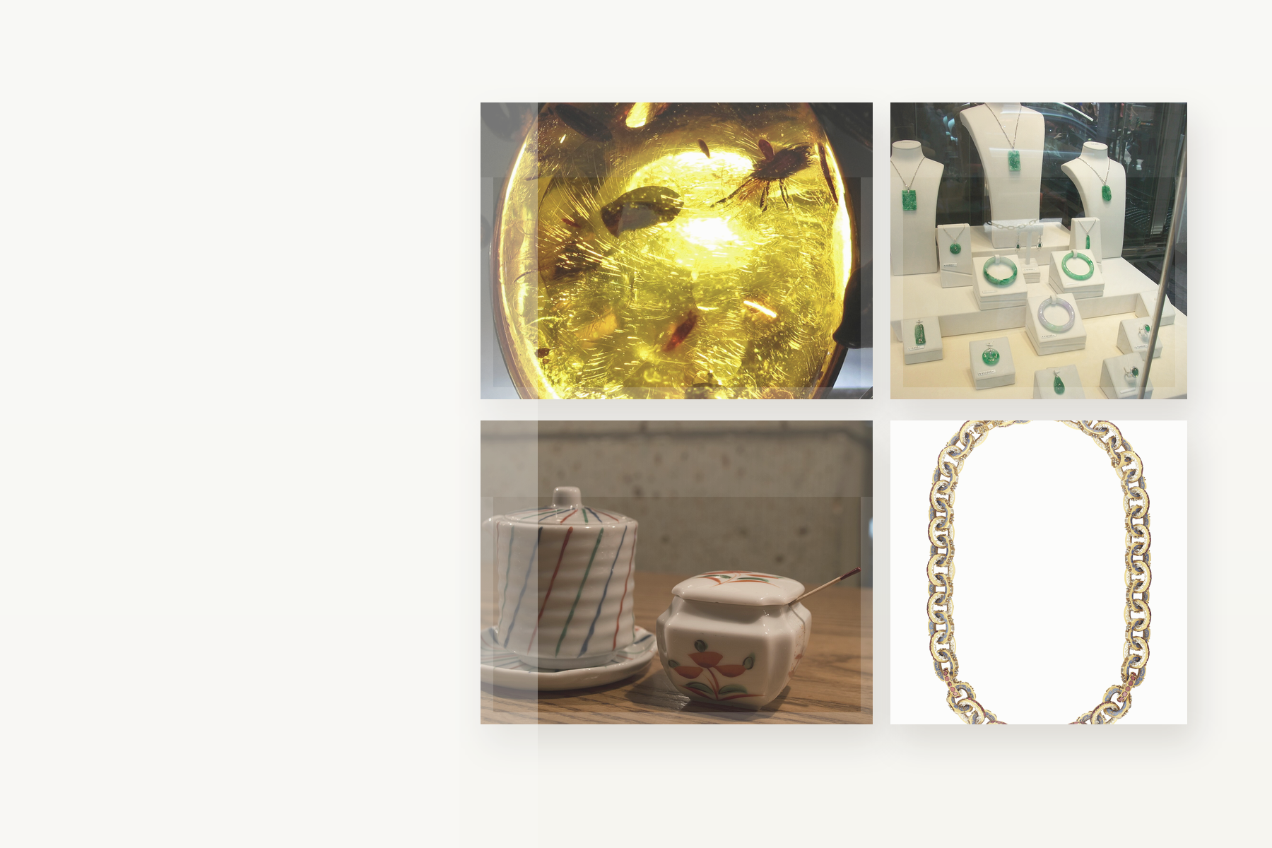 Amber, jade, jewelry, and Japanese collectible objects arranged on a calm tabletop